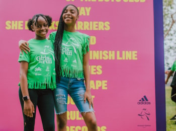 Two Girls on the Run participant both smile with an arm around each other