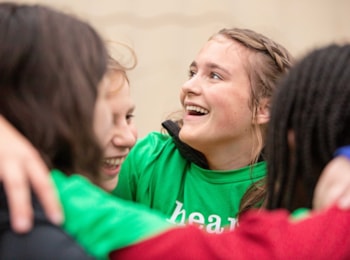 Two Girls on the Run participant both smile with an arm around each other